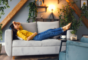 woman relaxing on couch after periodontal surgery